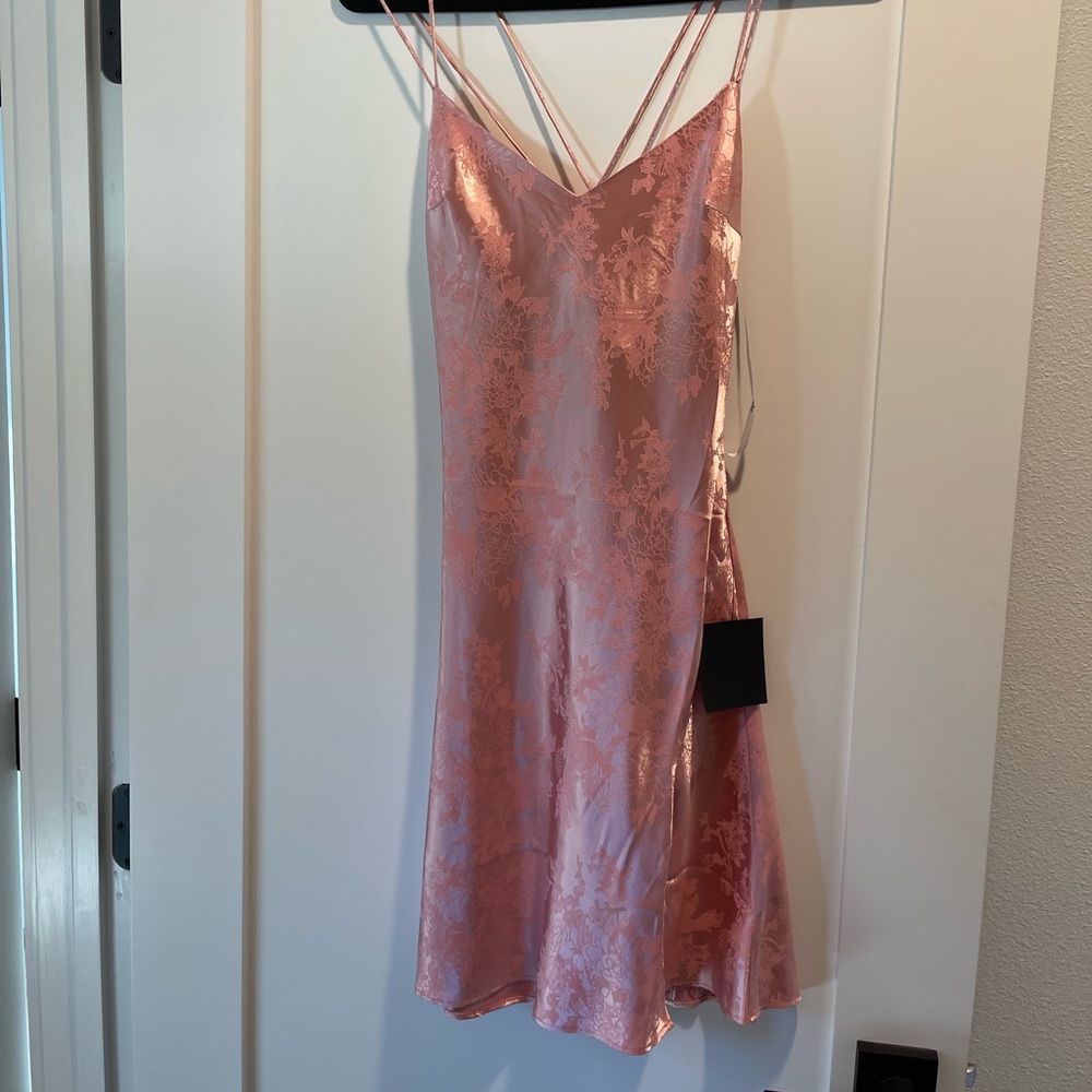 Lulu’s pink satin mini with floral print and crisscross straps